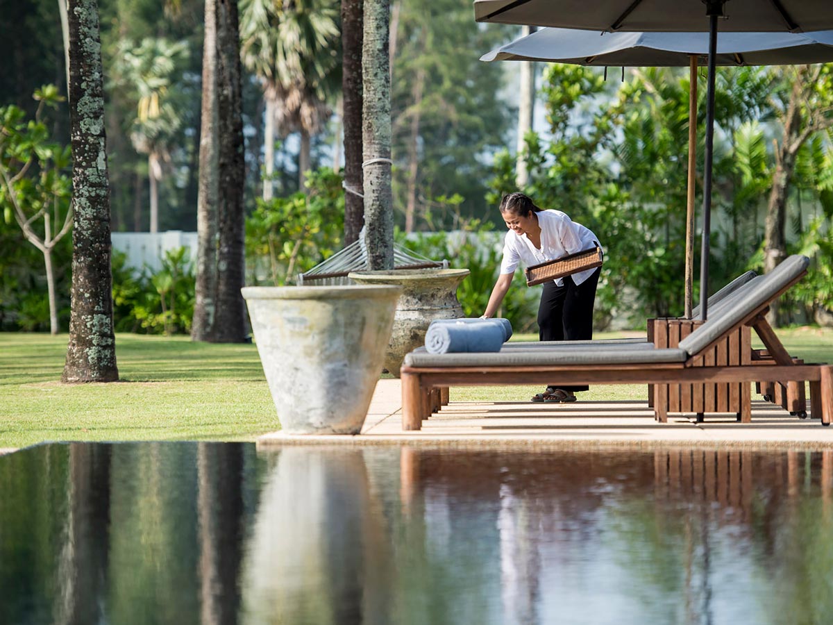 A staff making sure that everything is in order before the guest arrives