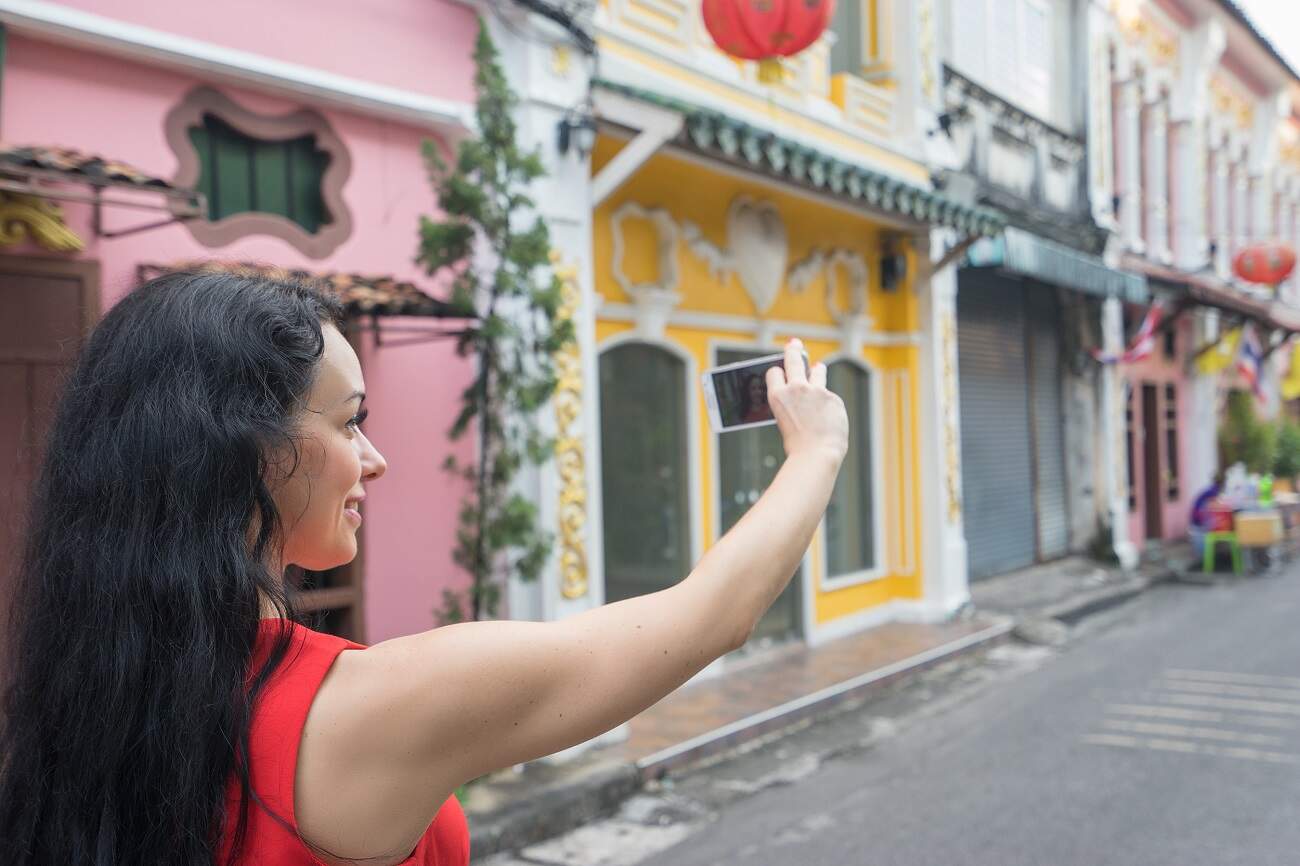 A Young Traveler Having an Instagram Moment at Phuket Old Town