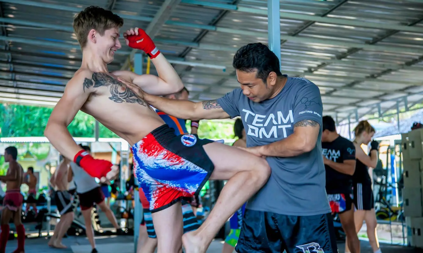 A guest learning the basics of Muay Thai